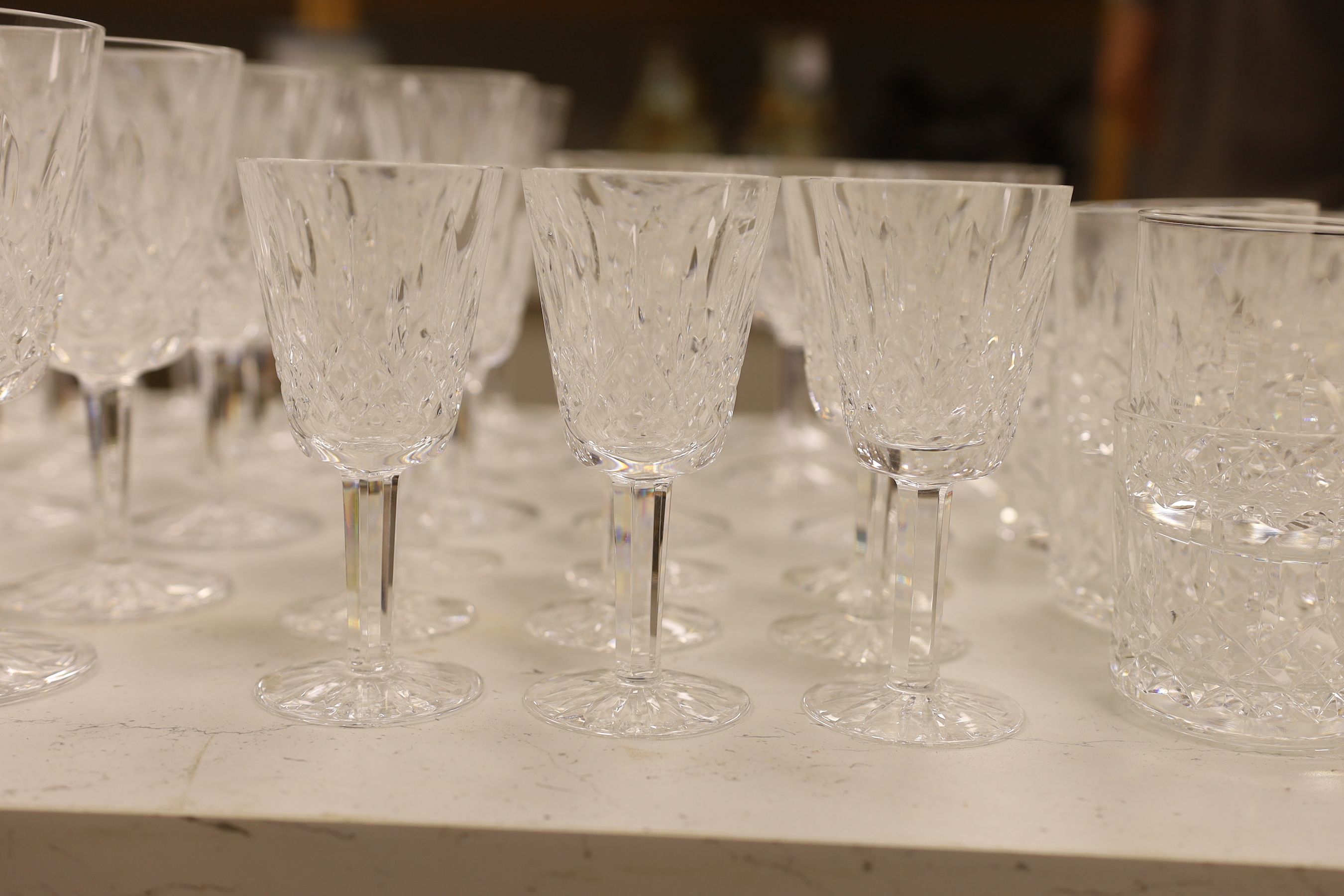A 68 piece part suite of Waterford cut crystal ‘’Lismore’’ pattern drinking glassware, consisting:- 12 champagne glasses, 9 red wine glasses, 6 white wine glasses, 12 liqueur glasses, 12 whisky tumblers, 12 sherry glasse